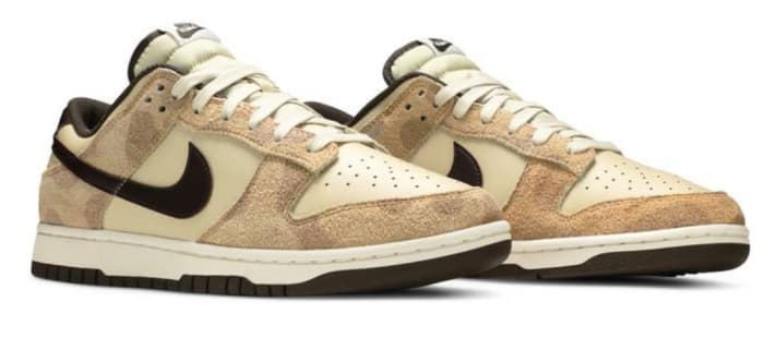 View of tan Nike Dunk shoes.